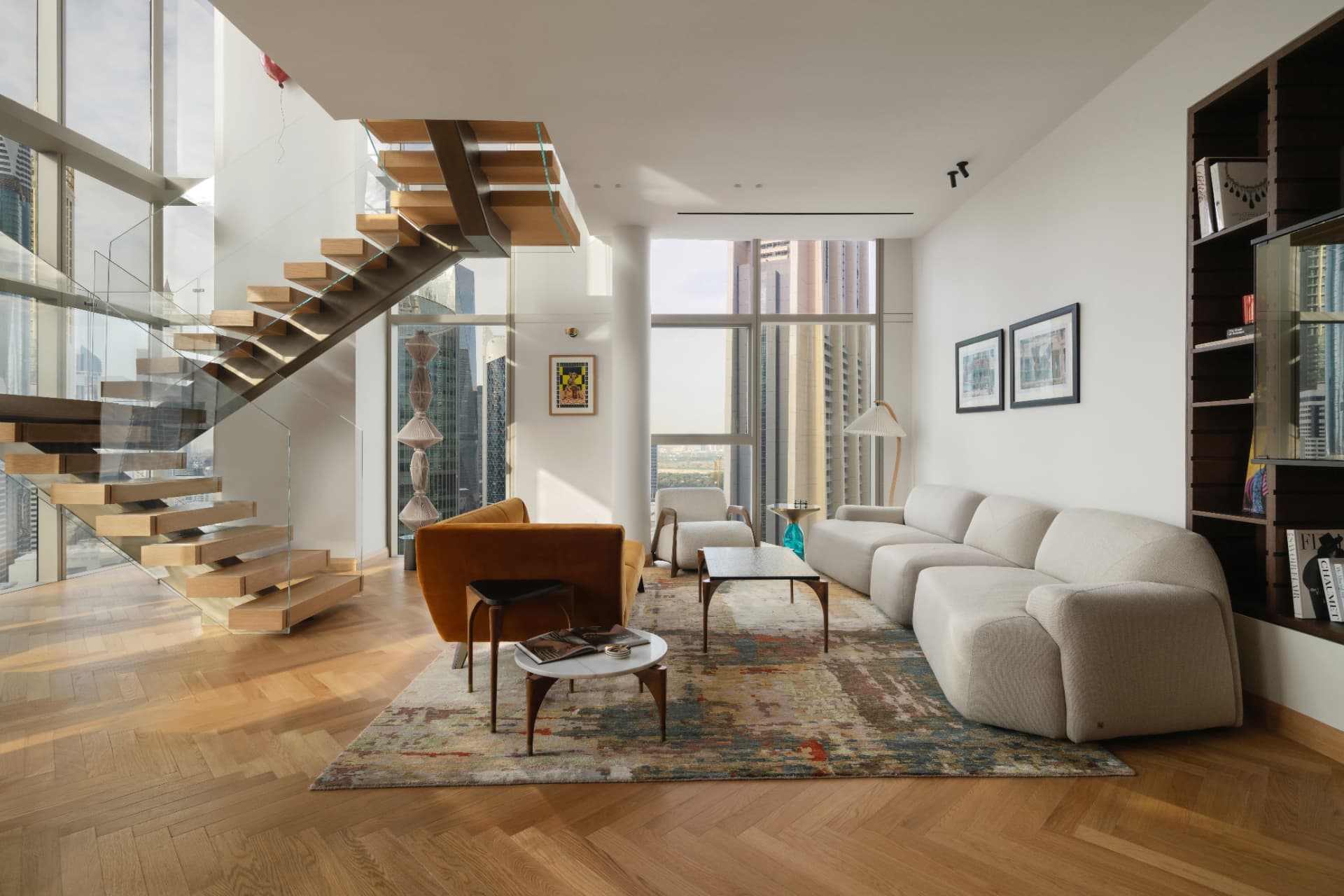 Phoenix interior — double-height living room with floating oak stair